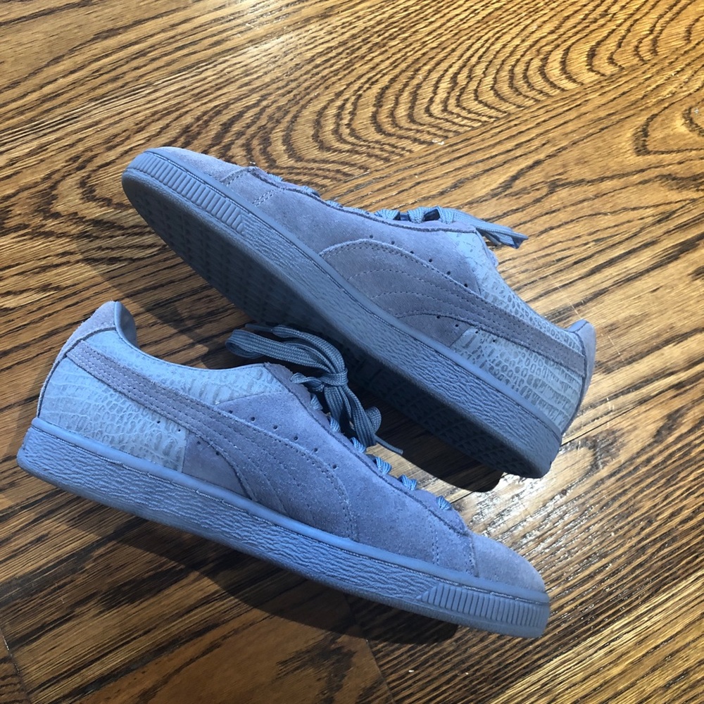 Blue Puma sneakers.